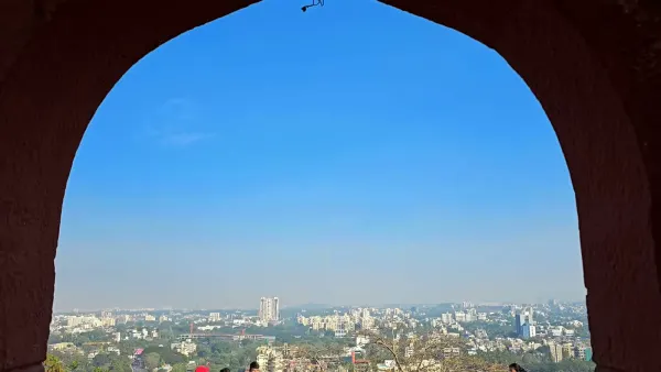 Pune city seen through an arch on Parvati Hill