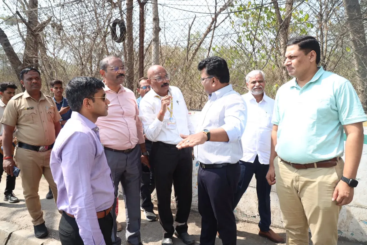 The Commissioner and officials at a road site near the airport