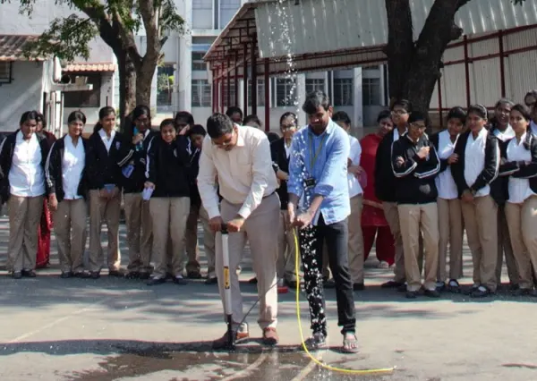 Students watch a water rocket launch at a STEM workshop